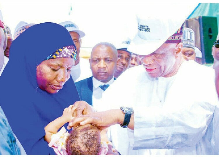 Yobe State SSG, Alh. Baba Mallam Wali mni while administering a vaccine during the launching of Measles-Rubella, Polio and other integrated vaccination campaign in Damaturu