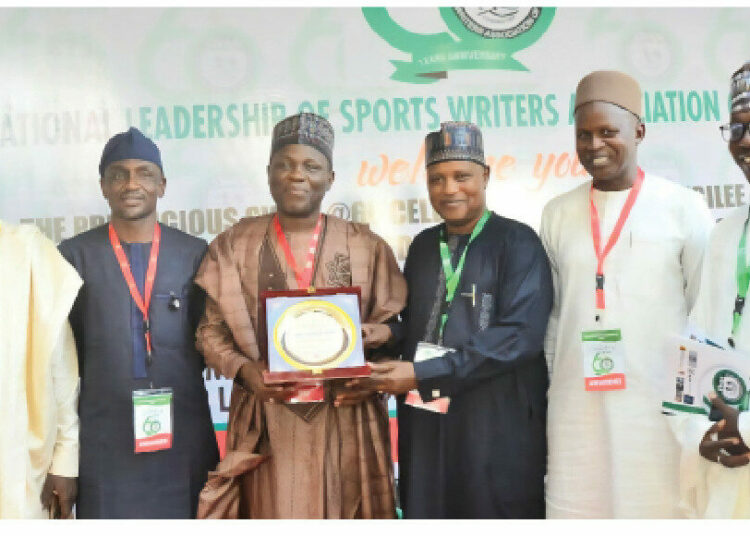 SWAN Honours Governor Buni For Support To Sports, Stadium Upgrade 1 3rd from left, Yobe Information Commissioner, Hon Abdullahi Bego shortly after receiving an award presented to Gov Buni by SWAN in Abuja