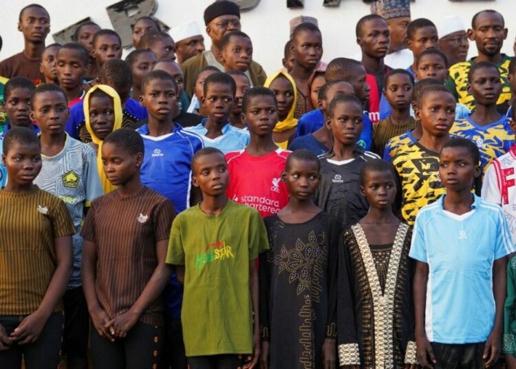 Abducted Niger School Students Drink Mud Water, Eat Once A Day – Parents 1 Schoolchildren abducted from St. Marys School pose for a photograph after arriving at the Niger State Government House following their rescue in Minna Nigeria December 8 2025. ReutersMarvell 1
