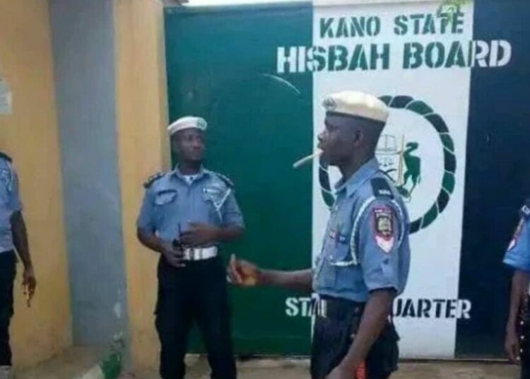 Hisbah Arrests 9 Suspects Over ‘Farewell To Satan’ Party In Kano By Hafsat Bello Bahara The Kano State Hisbah Board has arrested six women and three men for allegedly organising a party tagged “Farewell to Satan” ahead of the Ramadan fasting period. The Deputy Commander-General of the Hisbah Board, Dr. Mujahid Aminuddeen, disclosed this to journalists in the state. Aminuddeen said the suspects organised a casual party over the weekend and invited some controversial musicians known for promoting immoral acts to perform at the event, which they claimed was meant to bid farewell to the devil or satan before the commencement of holy month of Ramadan fasting on February 18, 2026. He stated that the action contravened moral standards and existing laws in Kano State. The deputy commander-general added that the suspects would be charged to court upon the conclusion of investigations. He further called on members of the public to remain vigilant and report any activity that violates moral values or the law to the authorities. 1 Kano Hisbah Board