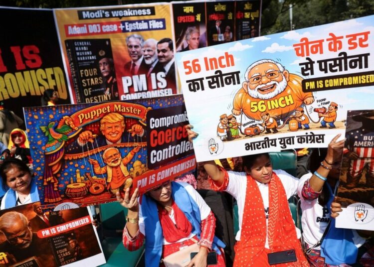 Protests Erupt In New Delhi Over Indian PM’s Name In Epstein Files 1 Indian Youth Congress supporters hold placards and shout slogans against Indian Prime Minister Narendra Modi after his name surfaced in the Epstein files, and over a row in parliament linked to excerpts from former Chief of Army Staff General M.M. Naravane's unpublished memoir quoted by the opposition, in New Delhi, India, February 10, 2026. REUTERS/Anushree Fadnavis