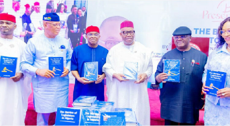 L-R: Deputy Senate Whip, Onyekachi Nwaebonyi; Governor Umo Eno of Akwa Ibom State; ADC national chairman, Senator David Mark;  Senate President, Godswill Akpabio; Senator Effiong Bob (the Author) and his wife, Comfort, during the public presentation of the book, “The Burden of Legislators in Nigeria,” at the NAF Conference Centre, Abuja, yesterday. PHOTO: SENATE PRESIDENT’S OFFICE.