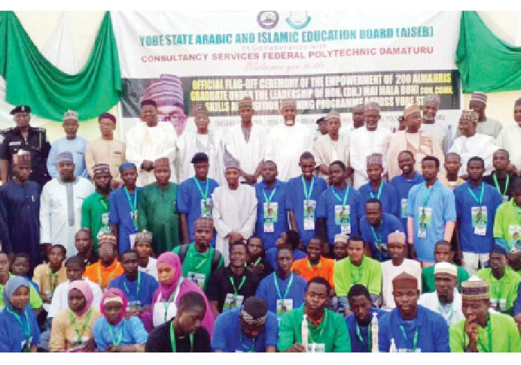 Group photograph during the graduation of Almajiris trained in ICT, Solar installations among others in Damaturu