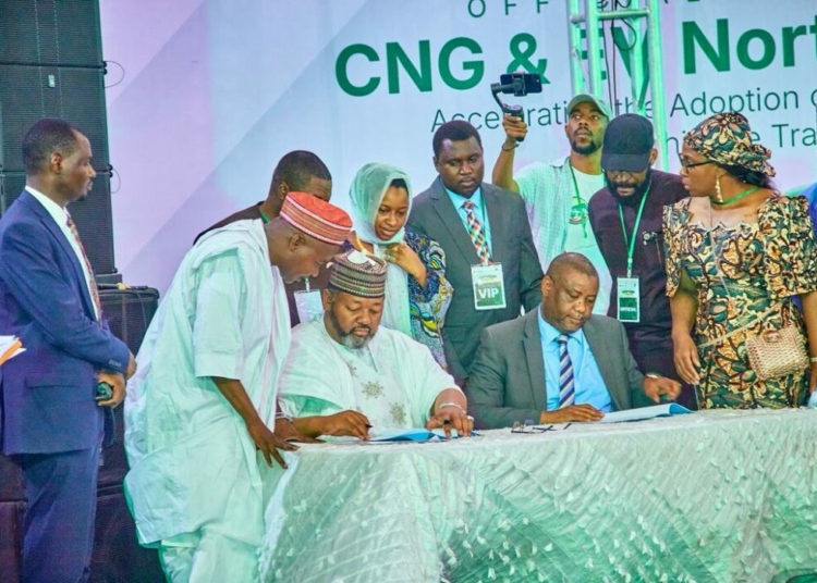 Federal Govt, LOTUS Bank Back Northern Corridor CNG, EV Rollout To Lower Transport Costs 1 Seated L-R: Executive chairman, Presidential Compressed Natural Gas Initiative (PCNGI), Ismael Ahmed and regional head Northeast and Northwest, LOTUS Bank; Nazif Ibrahim, signing the PCNGI partnership agreement while other dignitaries watch in Kano, Kano State: PHOTO: LOTUS Bank