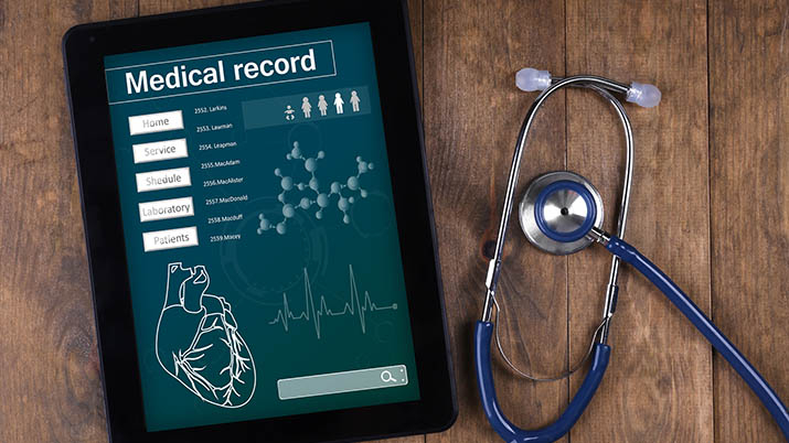 Federal Govt Expands Electronic Medical Records Deployment Across Health Facilities 1 Medical record on tablet screen with stethoscope on wooden background