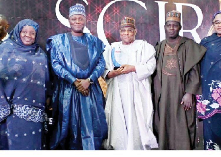 Gov Buni Bags BusinessDay Award Over Mega Agric Empowerment Programme 1 Yobe Agric Commissioner, Hon. Ali Mustapha (Middle in White) and the Commissioner of Information, Hon Abdullahi Bego (Middle in Blue) shortly after receiving an award on behalf of Gov Buni over intervention in agriculture by BusinessDay Newspaper in Abuja