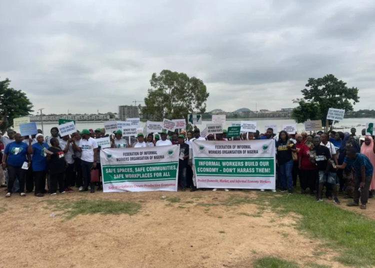 Informal workers protesting the displacement of traders at the Jabi lake park in Abuja on Tuesday 1782814362