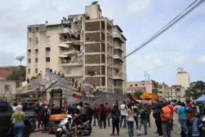 People and rescuers work on the debris of a collapsed building after a magnitude 7.2 earthquake struck Venezuela 062626 2429360714be4d9fb94ac80ce41ef41f