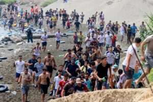 Spain Deploys Troops As 49,000 Migrants Cross Into Ceuta, 19 Dead 4 Migrants reach Spanish territory after swimming from Morocco to Ceuta, a Spanish enclave in north Africa, on Thursday. Reduan Dris/EPA/Shutterstock
