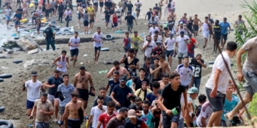 Spain Deploys Troops As 49,000 Migrants Cross Into Ceuta, 19 Dead 2 Migrants reach Spanish territory after swimming from Morocco to Ceuta, a Spanish enclave in north Africa, on Thursday. Reduan Dris/EPA/Shutterstock