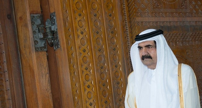 Federal Government Condoles Qatar Over Death Of Former Emir Sheikh Hamad 1 (FILES) Qatari Emir Sheikh Hamad bin Khalifa al-Thani awaits for France's President Francois Hollande prior to a welcoming ceremony at the Diwan Emiri as part of a two-day official visit in Doha on June 23, 2013. Qatar's government on July 12, 2026 announced the death of former leader Sheikh Hamad bin Khalifa Al Thani, who led the country from 1995 to 2013. (Photo by BERTRAND LANGLOIS / AFP)