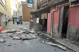 Several Trapped As 7.1-Magnitude Earthquake Rocks Japan, Shopping Mall Partially Collapses 2 The exterior wall of a shop is seen collapsed in Tuesday's earthquake in Kumamoto City. JIJI Press/AFP/Getty Images