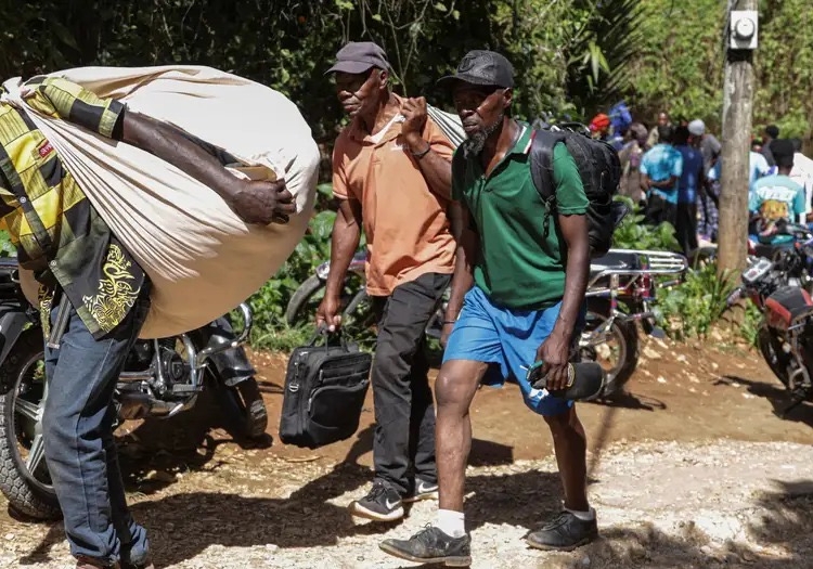 UN Chief Condemns Haiti Gang Attack As 47 Die, Over 50 Kidnapped 1 Survivors of the attack fled with whatever belongings they could carryImage: Photo credit: Patrice Noel/REUTERS