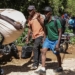Survivors of the attack fled with whatever belongings they could carryImage: Photo credit: Patrice Noel/REUTERS