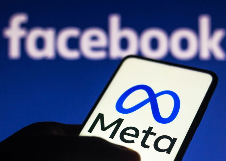 October 29, 2021, Brazil. In this photo illustration the Meta logo seen displayed on a smartphone and in the background the Facebook logo