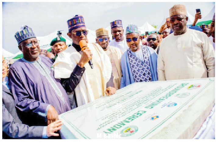 Yobe State Gov Hon Mai Mala Buni (With Mic) while performing the groundbreaking ceremony for the Interconnected Hybrid Solar Mini-Grid project in Damaturu
