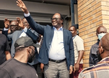 Presidential candidate Brian Muntayalwa Mundubile waves at supporters in Lusaka, Zambia [AFP]