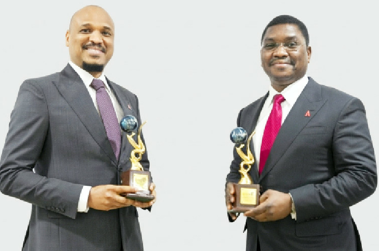 Joda, TAJBank Clinch GIFA 2026 Awards in London 1 L-R: TAJBank Limited’s founder/managing director, Hamid Joda, displaying the plaque of the ‘Islamic Banker of the Year Award 2026’ conferred on him by the Global Islamic Finance Awards (GIFA) organisation while the bank’s co-founder/executive director, Sheriff Idi, also displays the bank’s ‘Championship Award (Digital Banking) 2026’ plaque issued at the rating organisation’s 16th annual awards ceremony held in the United Kingdom…recently. PHOTO: TAJBANK