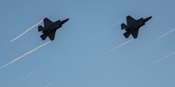 F-35s fly in formation with their afterburners during a kick-off celebration for the "Great American State Fair" on the National Mall in Washington, DC, on June 24. Ken Cedeno/AFP/Getty Images