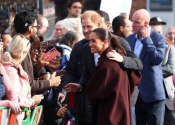 Britain's Prince Harry and Meghan, the Duke and Duchess of Sussex, greet well wishers as they arrive for a visit to The Community Recording Studio, a youth and community charity supporting young people through creative activities, mentoring and youth development, in Nottingham, Britain, October 15, 2026. REUTERS/Phil Noble