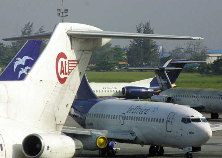 Lagos, NIGERIA:  A Bellview Airlines plane (R) is parked beside other airliners at the local wing of the Murtala Mohammed International Airport in Lagos , 23 October, 2005.  Photo credit: PIUS UTOMI EKPEI/AFP via Getty Images)