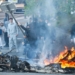 A protestor throws a stop sign into a fire as protesting students carry out blockading action near the Kerichen high school in Brest, western France, on October 2, 2026
