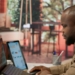 Business owner reviewing website traffic and international customer enquiries on a laptop in Lagos